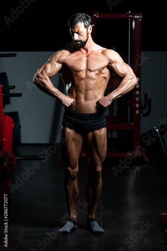 Muscular Bodybuilder Flexing Muscles