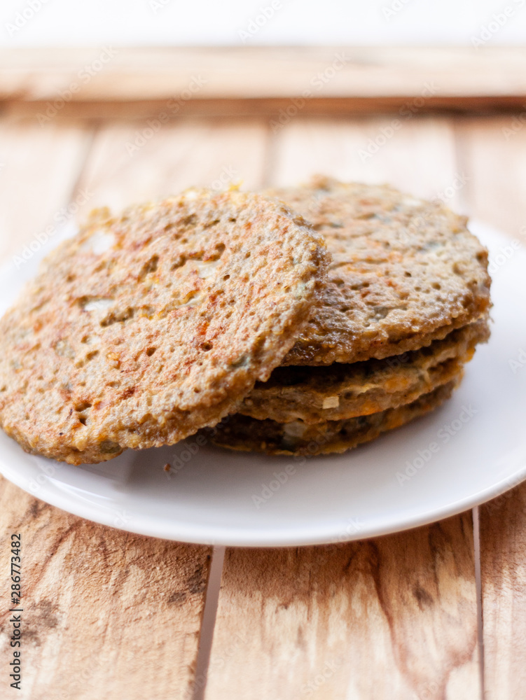 quinoa vegetable burger  on white dish