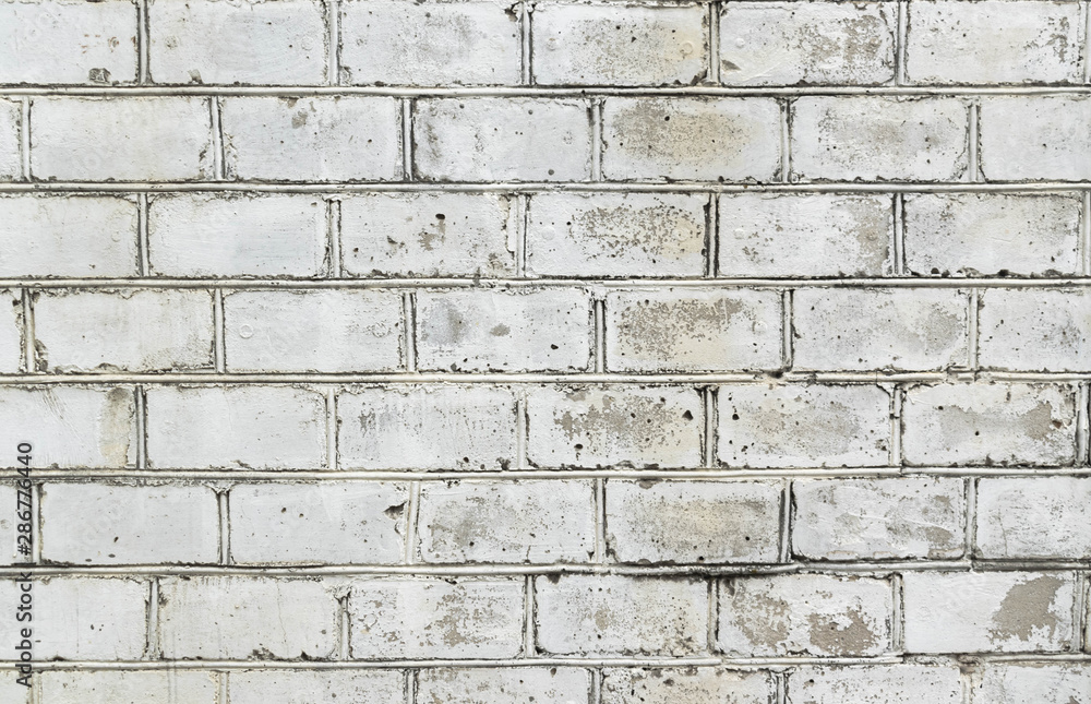 Fototapeta premium Background of a white brick wall. Masonry texture.