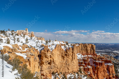 A snowy view over Bryce Canyon on a sunny winters day