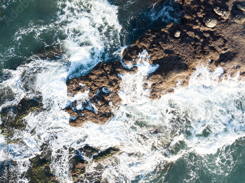 Aerial image birds eye view of rocky beach © DesiDrew Photography