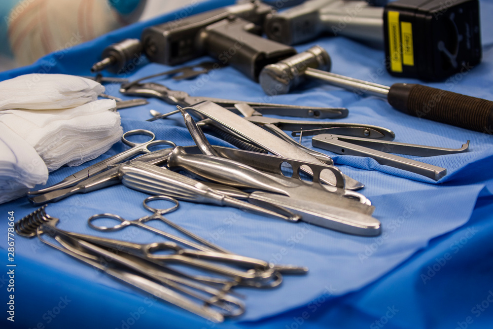 Work table with surgical tools during an operation in the operating room Work table with surgical tools during an operation in the operating room