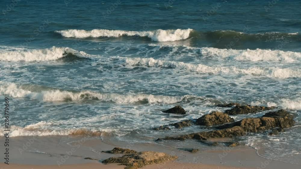 Beautiful waves in the sea, amazing nature beach background. Royalty high-quality stock video footage ocean water, sea surface, sand. Turquoise waves, clear water surface background for tex and design Beautiful waves in the sea, amazing nature beach background. Royalty high-quality stock video footage ocean water, sea surface, sand. Turquoise waves, clear water surface background for tex and design