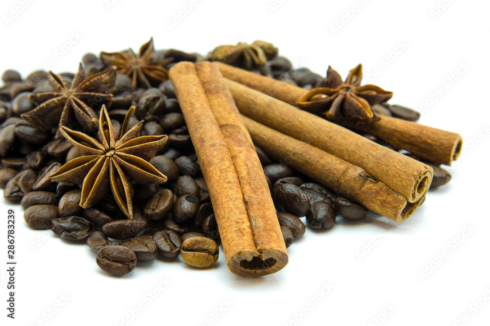 Closed up of coffee beans, anise and cinnamon sticks on white isolated background. Closed up of coffee beans, anise and cinnamon sticks on white isolated background.