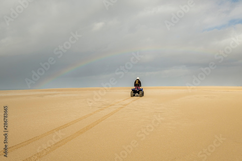 Quadbiking on sand dune  Stockton Sand Dunes  NSW  Australia