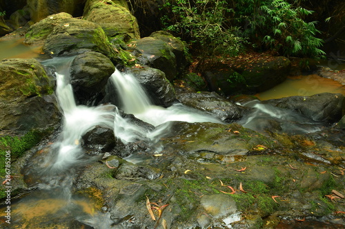 Water flowing over rocks with copy space for create your new idea khao ito waterfall prachin buri city Thailand. 