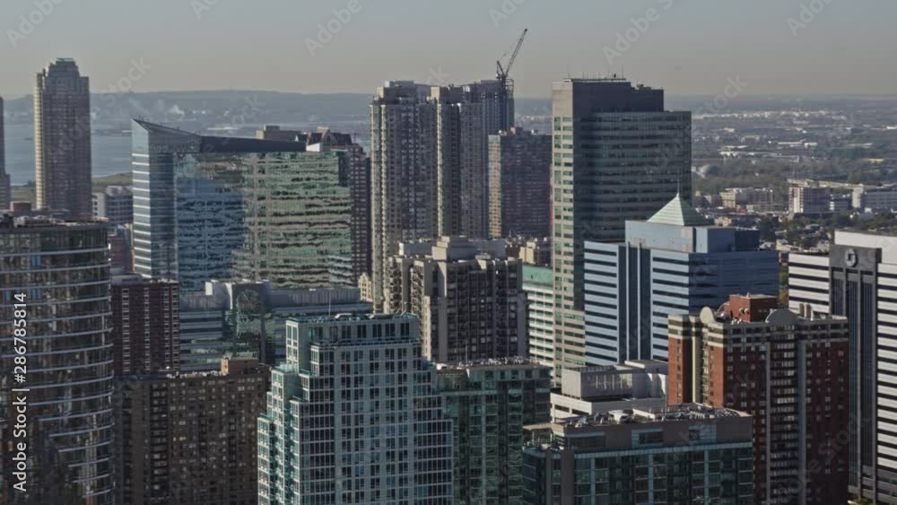 Jersey City New Jersey Aerial v12 Panning cityscape with Jersey City detail and Lower East side Manhattan views - October 2017 Jersey City New Jersey Aerial v12 Panning cityscape with Jersey City detail and Lower East side Manhattan views - October 2017