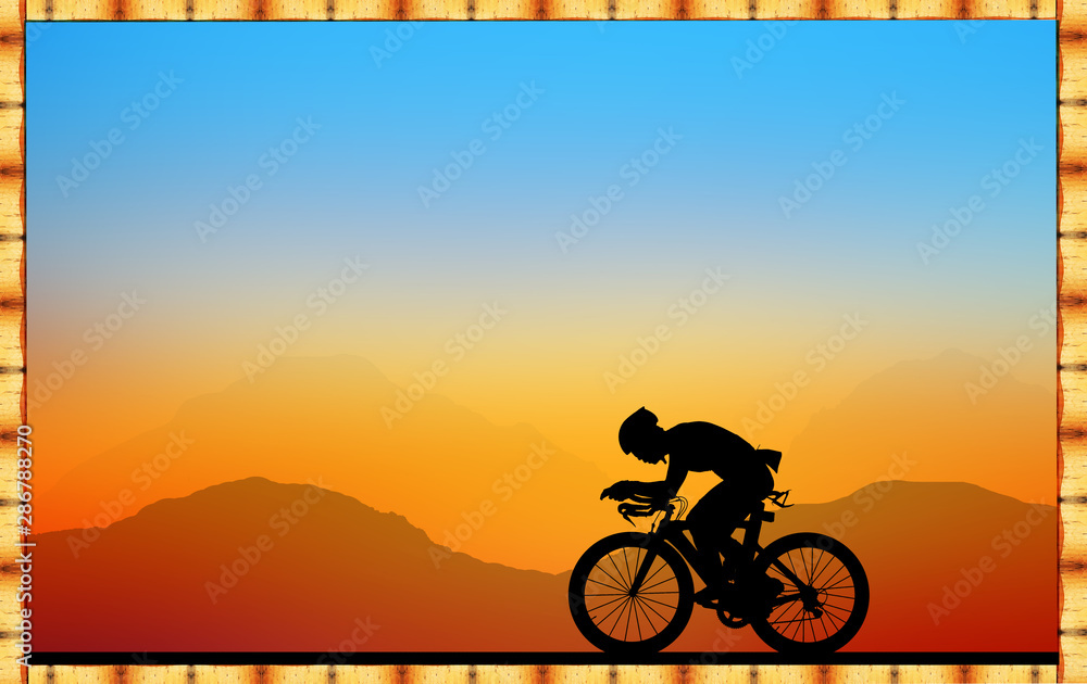 Fototapeta premium Silhouette Cycling on blurry sunrise sky background on a wooden sign