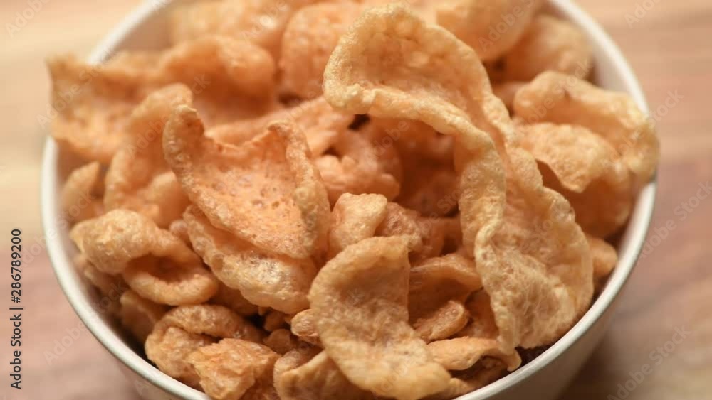White Bowl of Fried chicharrones (pork rind) White Bowl of Fried chicharrones (pork rind)