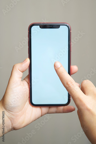 Female hand holding the iphone x