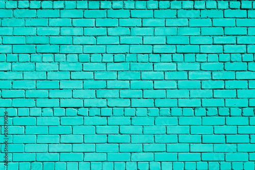 Turquoise colored brick background. Brick wall.