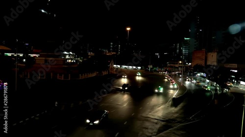 Wallpaper Mural Watching the cars on the victory monument in Bangkok at night. (Angle 5 - Slowmotion) Torontodigital.ca