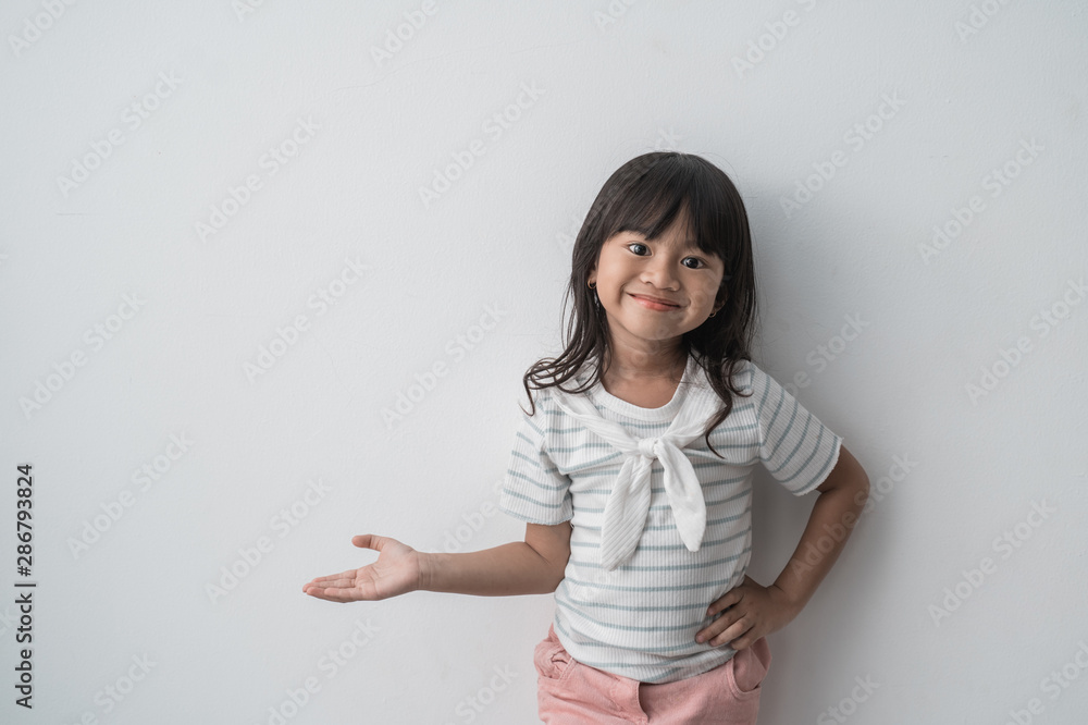asian cute little girl with present something in isolated background asian cute little girl with present something in isolated background