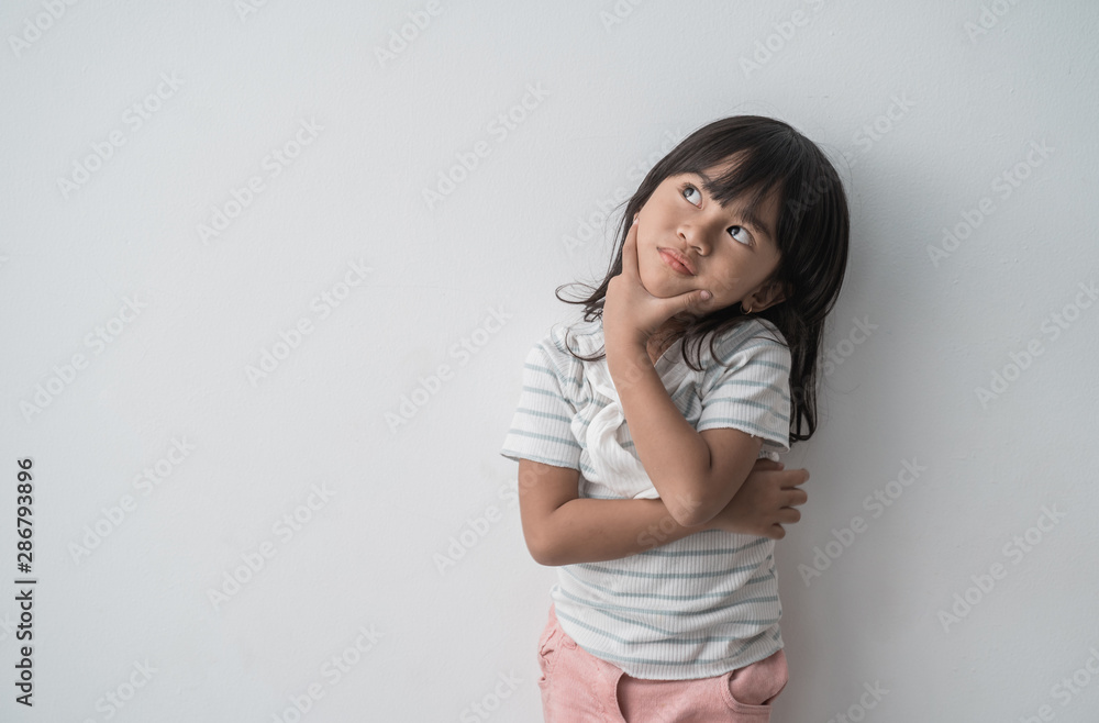 dreamy asian little girl looking up in white background dreamy asian little girl looking up in white background