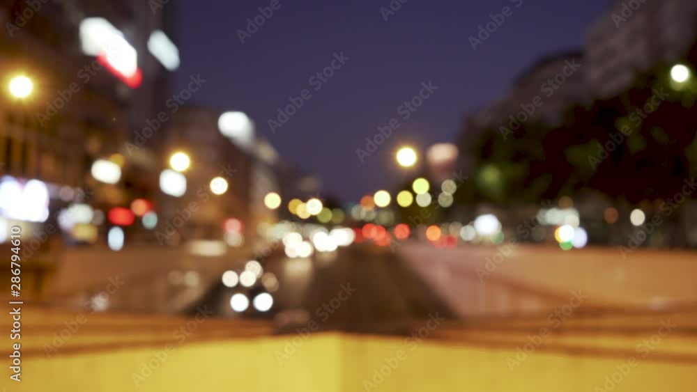 City at night with cars enter in tunnel with out of focus City at night with cars enter in tunnel with out of focus