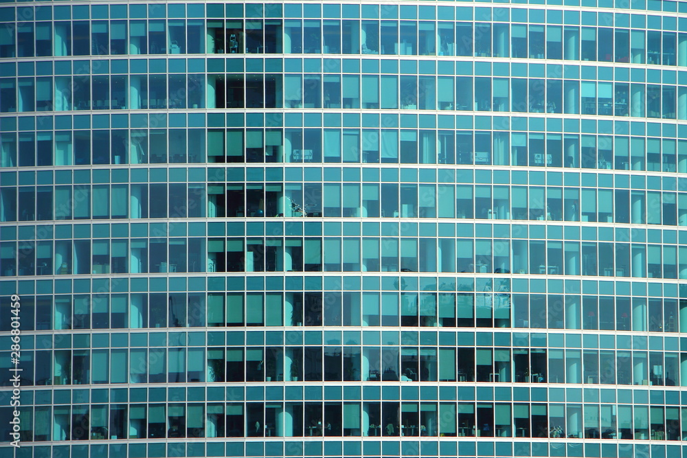 Fragment of wall of a modern office building with glass Windows, business center, finance, texture for background