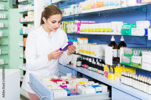 Pharmacist looking medicines in lockers