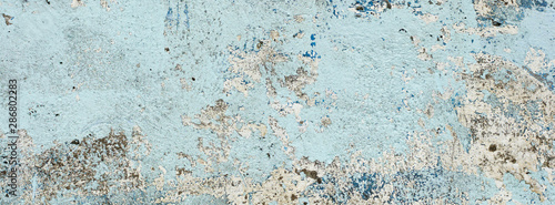 Panel kuchenny z motywem very old and dirty light blue paint texture peeling off the concrete wall for banner background