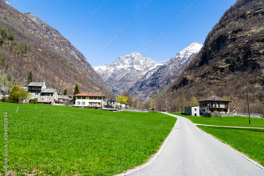 Rock valley , building and road in mountain of Sonogno in Locarno Ticino Switzerland