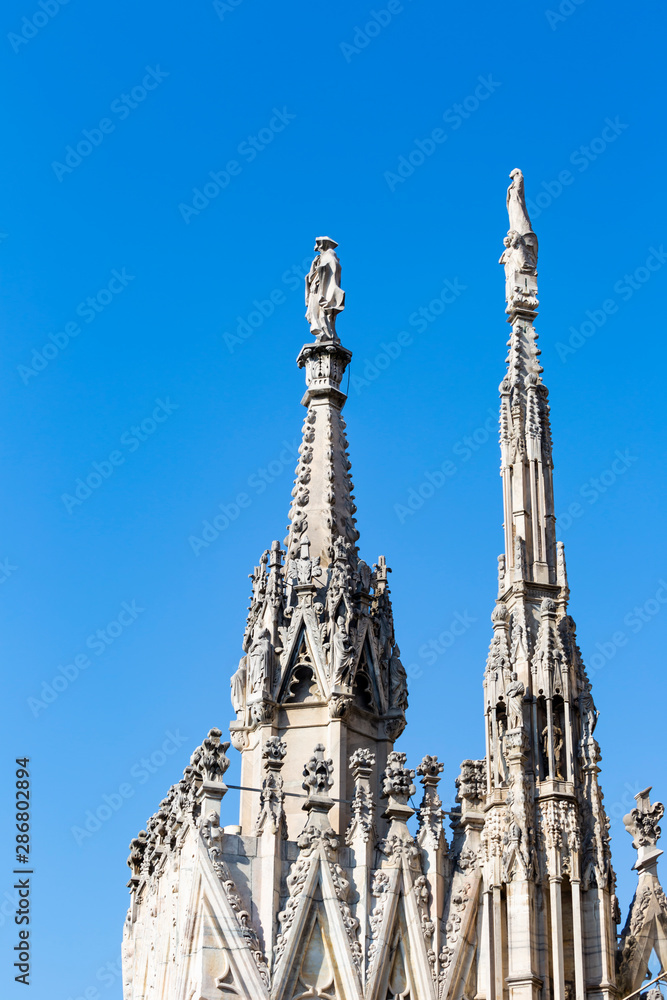 Aerial view of statue from Milan Duomo roof terrace , Italy