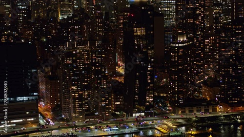 NYC New York Aerial v112 Panning nighttime birdseye detail of Murray Hill, East River riverfront with FDR traffic - October 2017