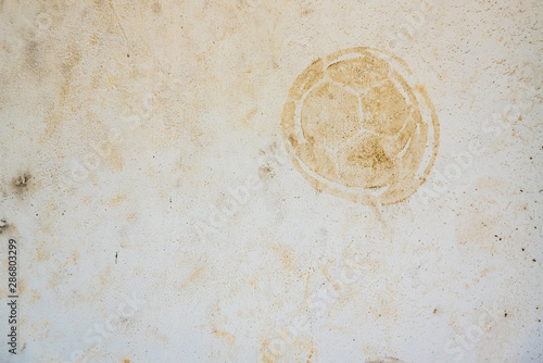 Wallpaper Mural Football print on cement background,soccer slough on wall. Torontodigital.ca