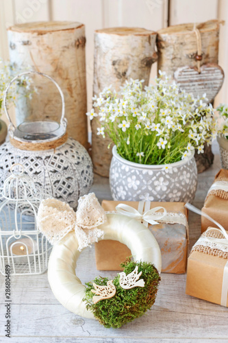 Beautifully wrapped gifts and flowers in the background photo