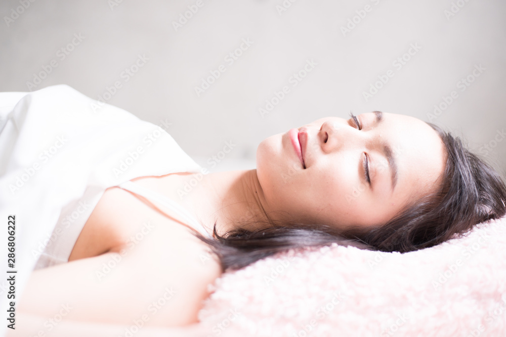 Young woman sleeping on bed Young woman sleeping on bed
