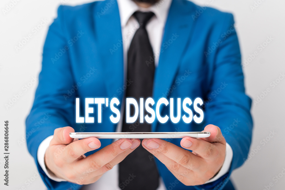 Handwriting text writing Let S Discuss. Conceptual photo asking someone to talk about something with demonstrating or showing Businessman in blue suite with a tie holds lap top in hands Handwriting text writing Let S Discuss. Conceptual photo asking someone to talk about something with demonstrating or showing Businessman in blue suite with a tie holds lap top in hands