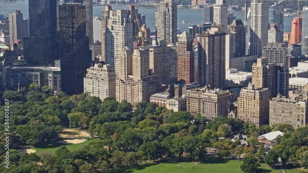 NYC New York Aerial v123 Low birdseye Central Park detail view panning to cityscape skyline of Central Park West and Hudson river - October 2017 NYC New York Aerial v123 Low birdseye Central Park detail view panning to cityscape skyline of Central Park West and Hudson river - October 2017
