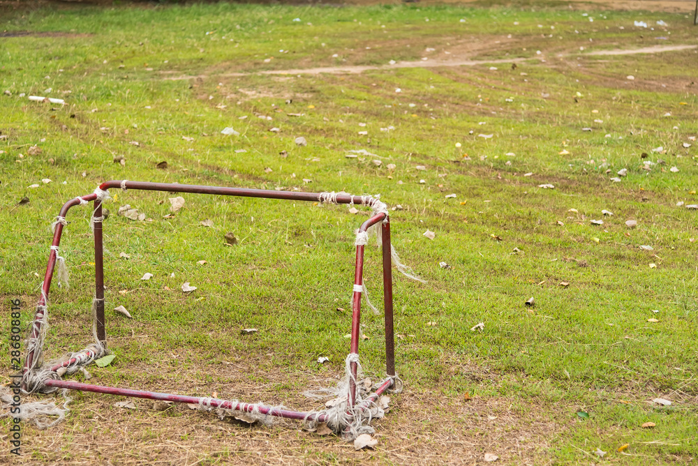 Old rust football goal abandoned soccer goal field located on the ground. Old rust football goal abandoned soccer goal field located on the ground.