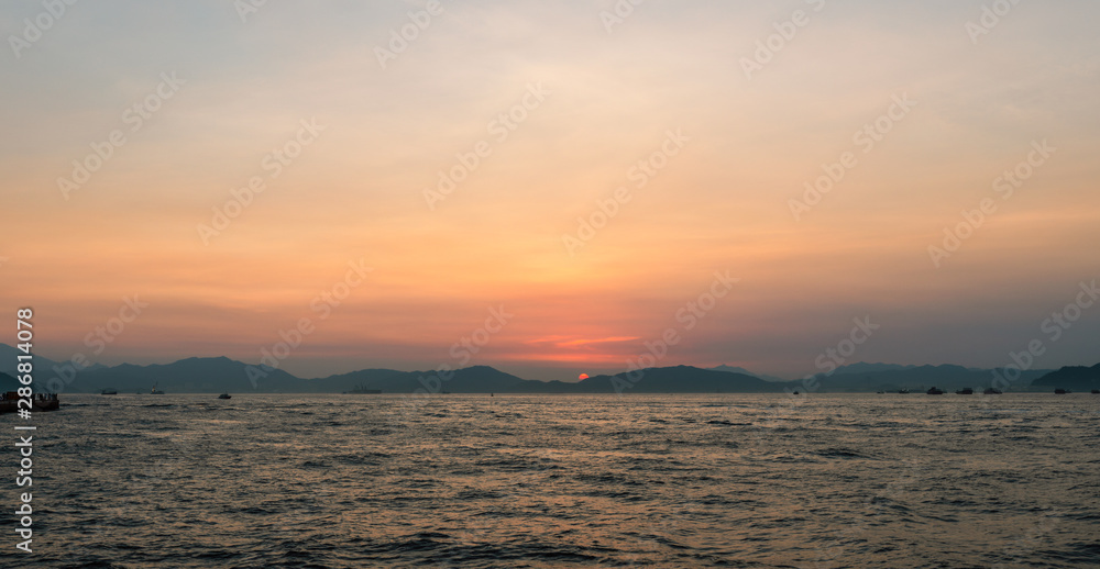 Sunset over the Lantau Island viewed from the West Ring of Hong Kong Island, Hong Kong.