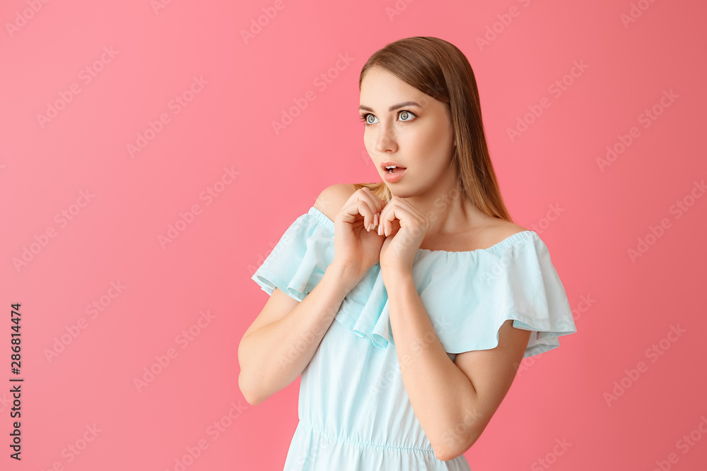Scared young woman on color background Scared young woman on color background