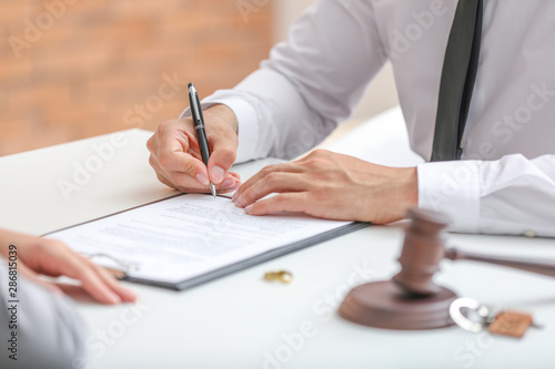 Couple visiting divorce lawyer in office
