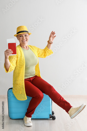 Happy mature woman with lug...