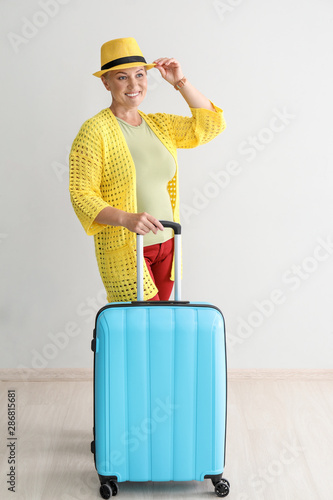 Happy mature woman with lug...