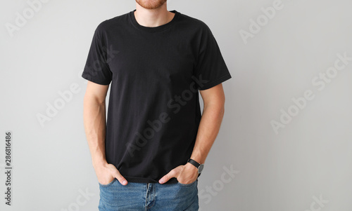 Man in stylish t-shirt on l...