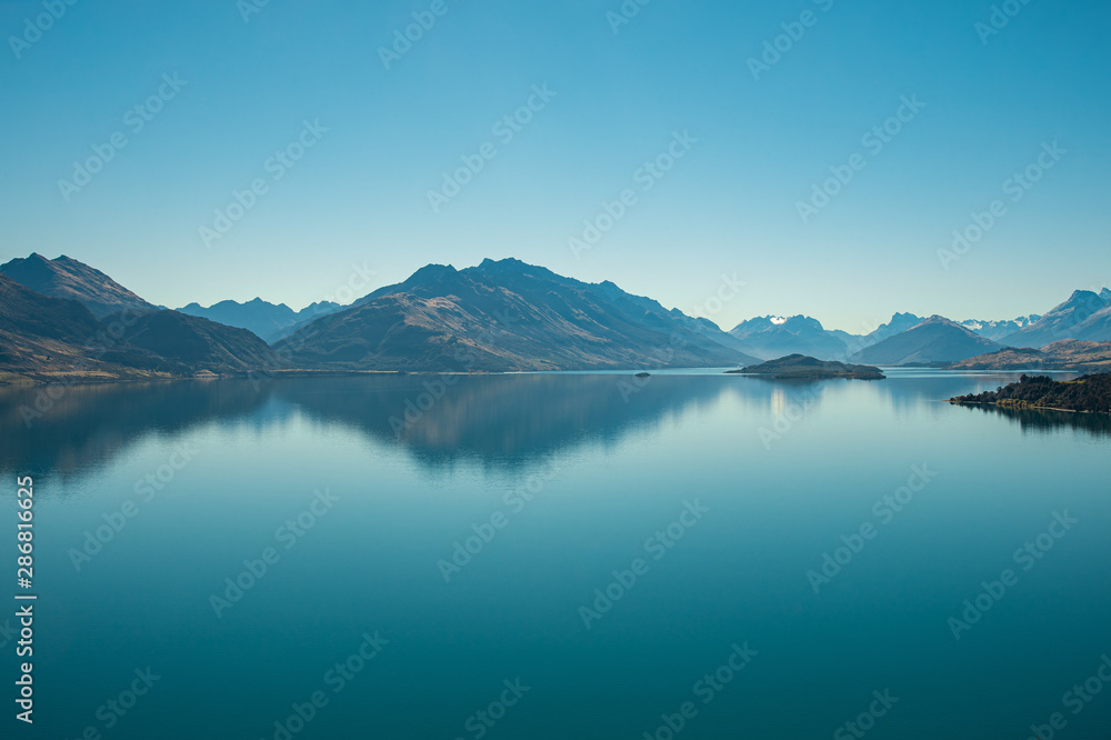Amazed nature scenic landscape of invisibly mountain, clear blue sky reflection in turquoise lake, popular view point on the way to Glenorchy, South New Zealand.