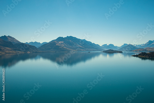 Amazed nature scenic landscape of invisibly mountain, clear blue sky reflection in turquoise lake, popular view point on the way to Glenorchy, South New Zealand. © Jack Tamrong