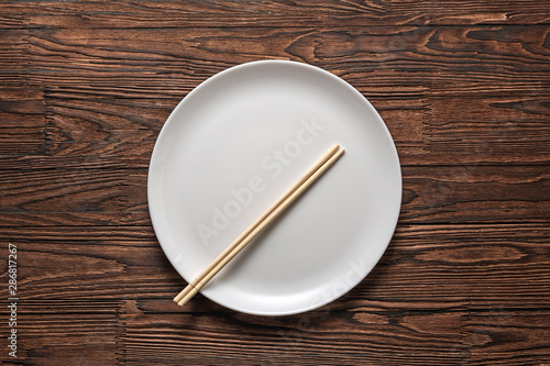 empty dish with bamboo chopsticks