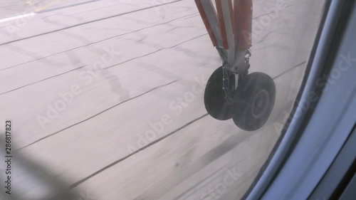 Wallpaper Mural Slow Motion View Through Plane Window of Airplane's Tires Making First Contact with Runway During Landing - Disko Bay, Greenland Torontodigital.ca