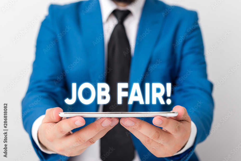 Handwriting text writing Job Fair. Conceptual photo event in which employers recruiters give information to employees Businessman in blue suite with a tie holds lap top in hands Handwriting text writing Job Fair. Conceptual photo event in which employers recruiters give information to employees Businessman in blue suite with a tie holds lap top in hands