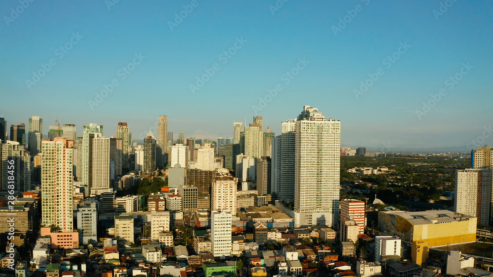 Obraz premium Skyscrapers and business centers in a big city Manila. Modern metropolis in Asia, top view.