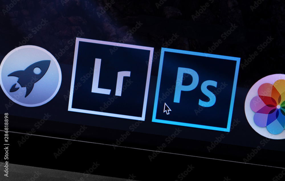 Apple Macbook with Adobe Photoshop and Lightroom icons app. Adobe Systems  Incorporated is an American multinational computer software company.  Moscow, Russia - May 10, 2019 foto de Stock | Adobe Stock