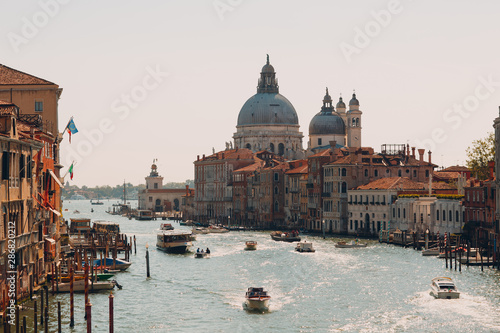 Old cathedral of Santa Maria della Salute and Grand Canal in Venice, Italy © primipil