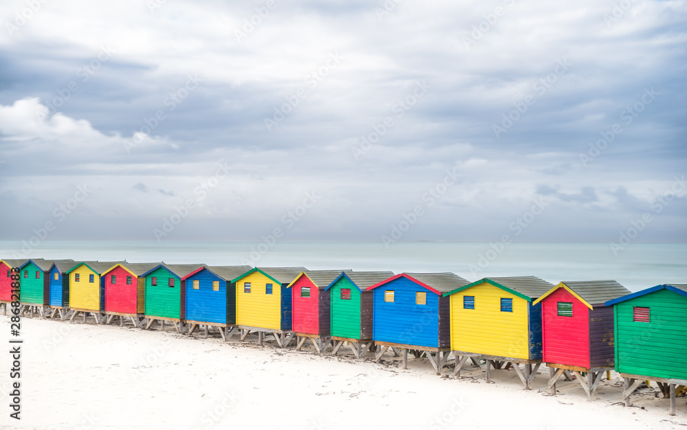 Multicolored cabins in a row on the beach at Muizenberg- South Africa