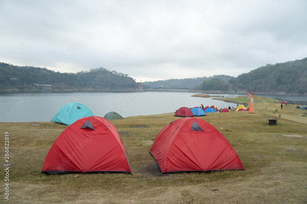 Two tents in the side lake in the morning
