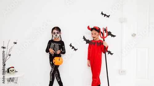 Asian child girls in halloween costumes
