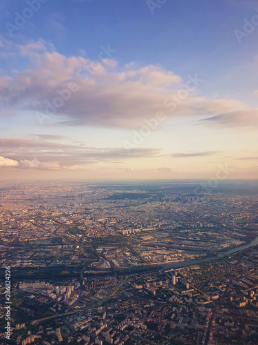 Obraz na plátně Aerial cityscape view from a plane over St Denis district and Seine river in Paris, France