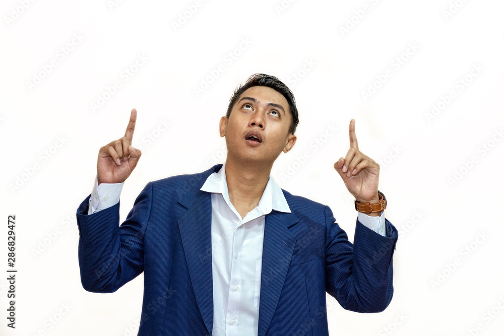young asian Businessman pointing up on copy space young asian Businessman pointing up on copy space